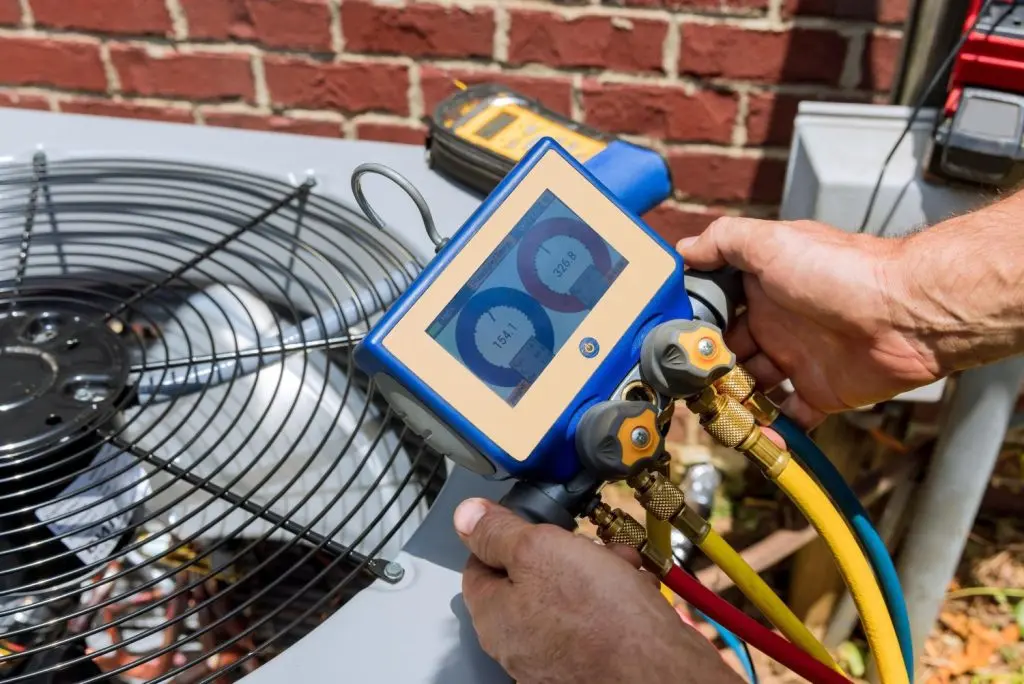 Technician performing an emergency HVAC repair.