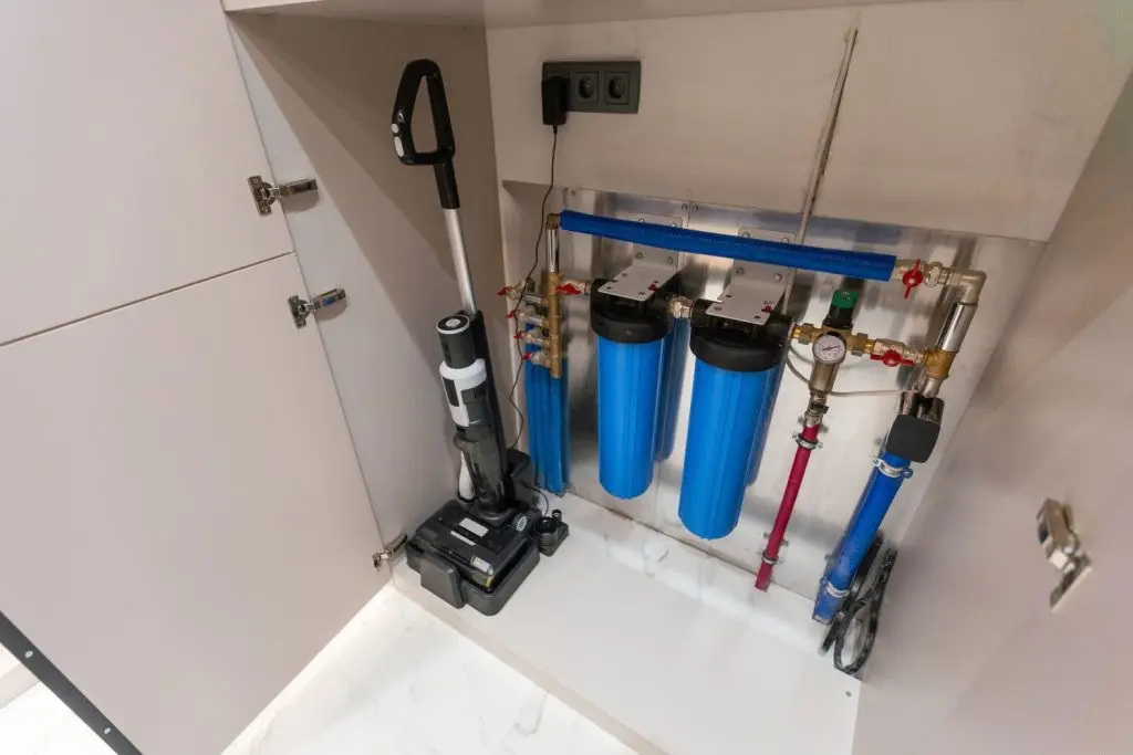 Whole-house filter system inside a maintenance closet.