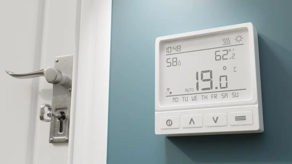 Recently repaired thermostat showing the temperature.