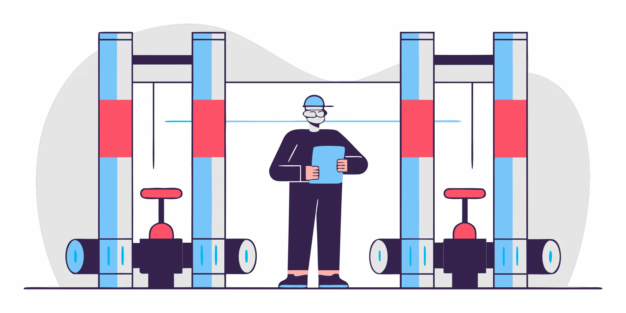 A plumber inspects the large pipes and valves of a commercial plumbing system.